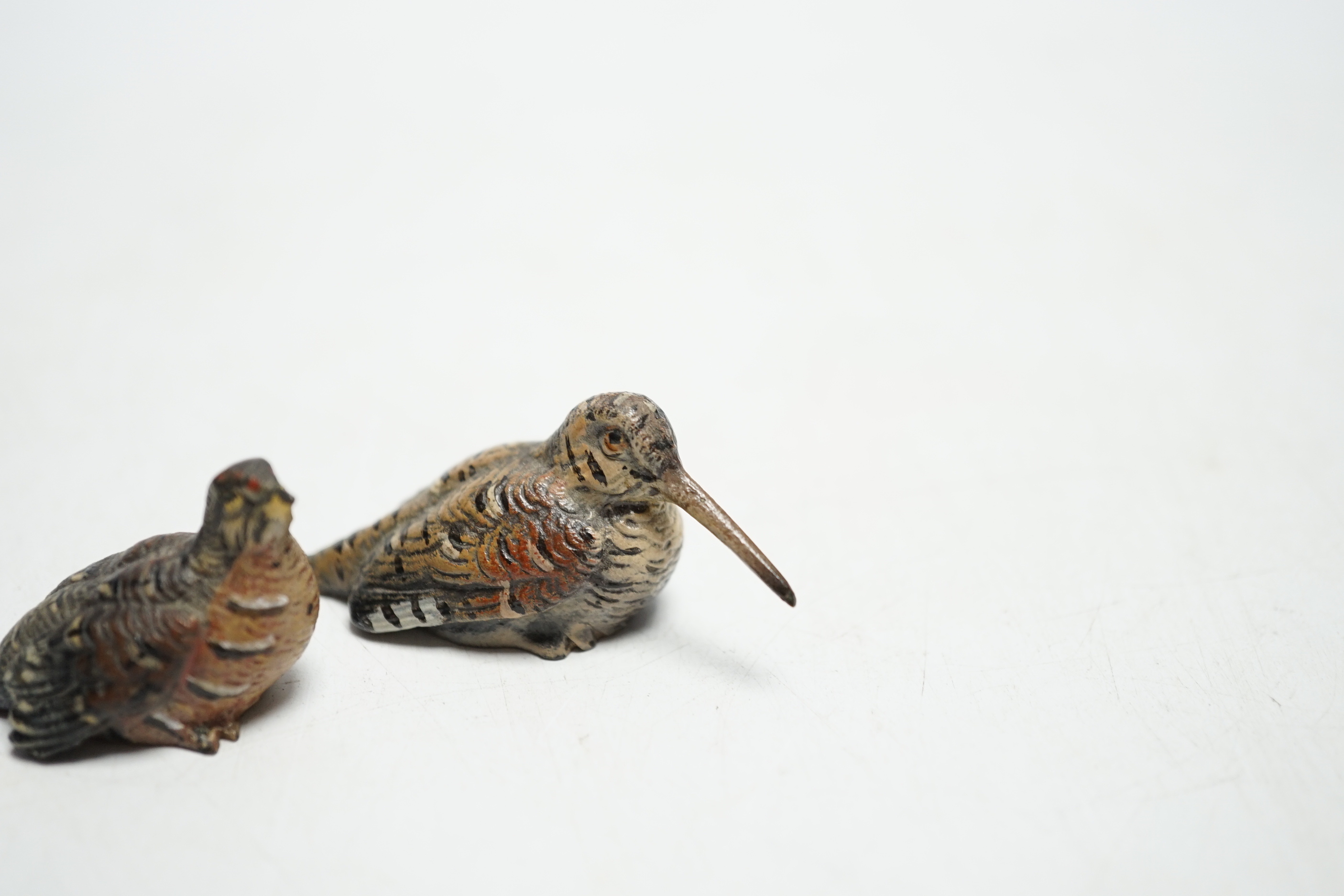 Two miniature Austrian cold painted bronze models of a snipe and partridge, longest 5cm